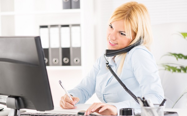 Beautiful Businesswoman telephoning and working in the office.