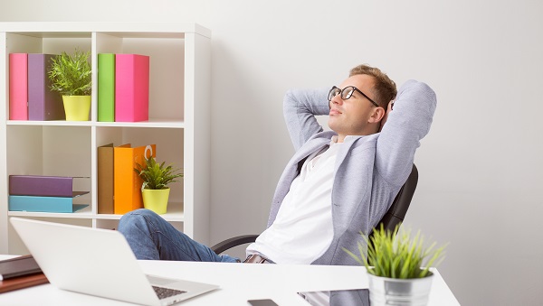 Relaxed businessman sitting in office